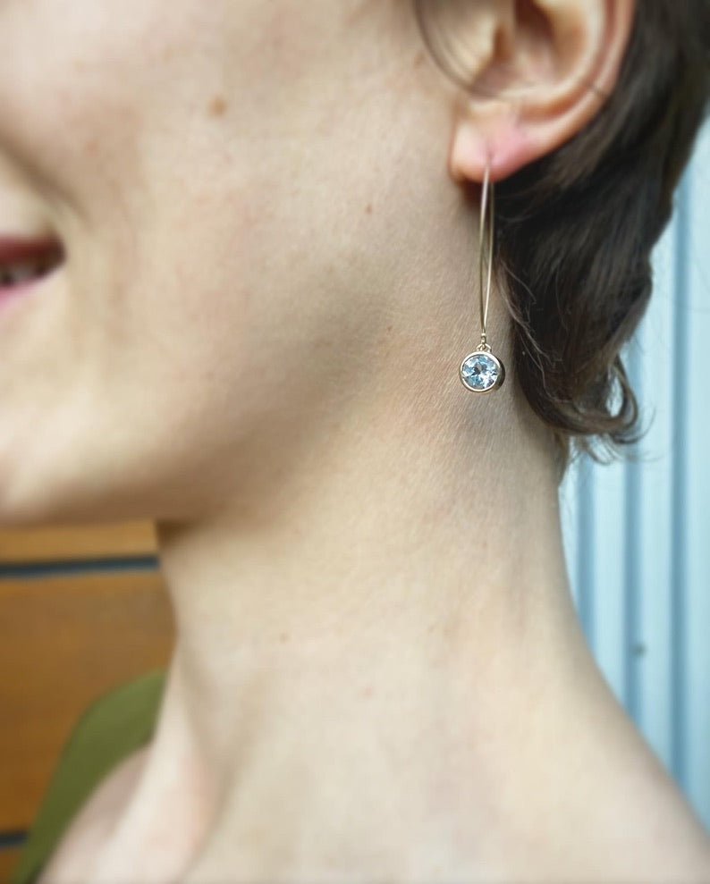 Large Gem Drop pendant dangling earrings in gold with 6mm faceted aquamarine gemstone, by Nina Alexandra.